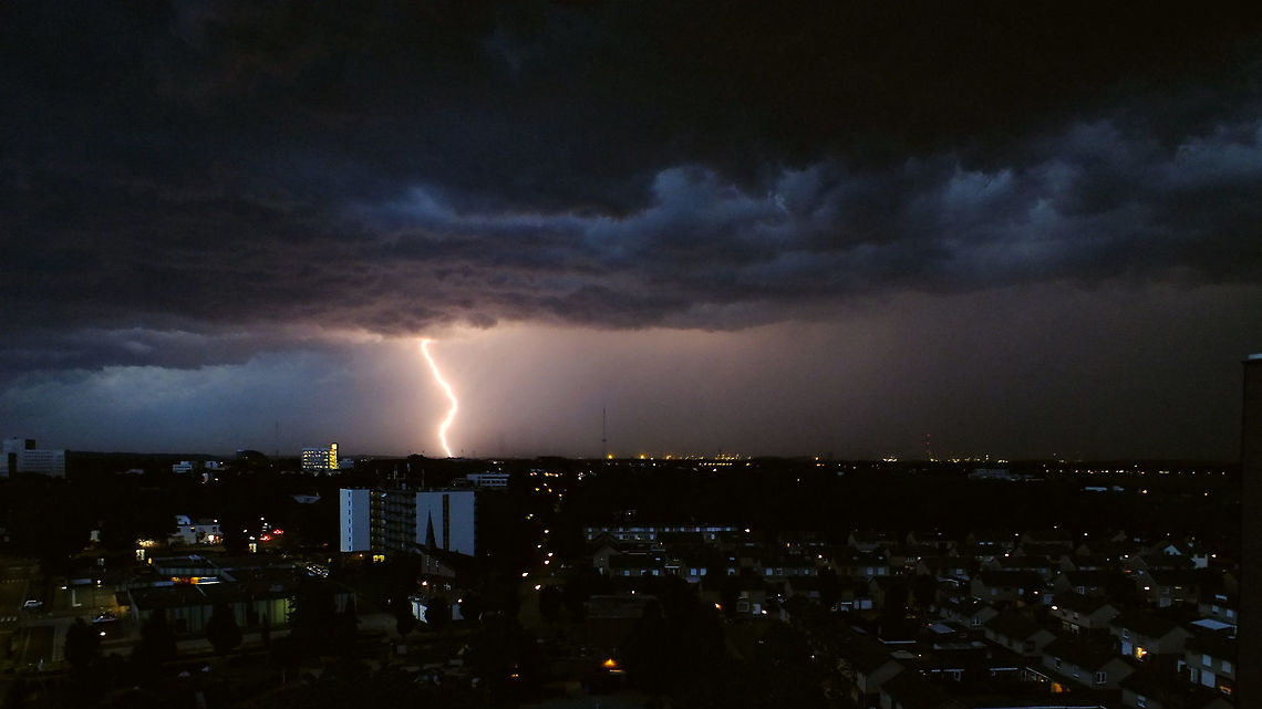 Lightning over Sittard Living on the 12th floor of an apartment building for a few month gave me a nice view on a storm rolling in over the town of Sittard (Netherlands). My storm photography skills need fine tuning still ;o)  Cloud,Clouds,Geotagged,Lightning,Netherlands,Sky,Storm