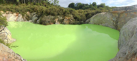 The Devil's Bath This eye-catching and awe-inspiring pool sits in a slight depression, likely created during a massive eruption from underground. 

It is well out of reach of visitors but the majority of it can be seen clearly from above. 

The bright green water and mud mix gets its colour from deposits of sulphur and ferrous salts that rise to the surface and float on top. 

There was quite a palette of mineral hues we saw across the location such as oranges, blues and reds that signify other volcanic elements. Geology,Geotagged,Geothermal,New Zealand,The Devil's Bath,Waiotapu,autumn,lake,landscape,scenery,volcanic lake