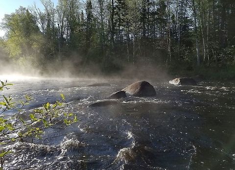 Temperance River So-named because it has no (sand) bar at the mouth where it enters Lake Superior. Often said to be the only river on Lake Superior without a bar at the mouth although there are several rivers with this feature. The Ojibwa name is Kawimbash which means "deep hollow river" and is a more fitting name because in its lower reaches the river has cut a deep gorge in the igneous bedrock which resulted when numerous potholes scoured by the river later became connected. Geotagged,Spring,Temperance River,United States,fog,mist,river,water