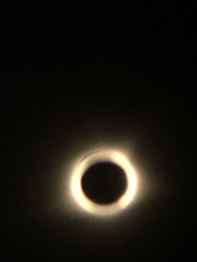 2017 Great American Eclipse: Totality Finally was able to download my eclipse photos from my computer to my phone! This was taken in 2017 on August 21st during the Great American Eclipse. We drove from central Wisconsin all the way down to the tip of the Illinois to the line of totality just so we could see this, and it was absolutely worth it. I took this by clipping my eclipse glasses over the the camera lens of my phone, then clipping a macro lens over that. That blue around it you see isn&rsquo;t actually camera error, that&rsquo;s the sun&rsquo;s corona! We got to see bailey&rsquo;s beads, the diamond ring, and the rare unexplained shadow snakes! Definitely an amazing trip, here&rsquo;s to hoping South Dakota holds a candle to it. Eclipse,Geotagged,Natural events,United States,solar eclipse,sun,totality