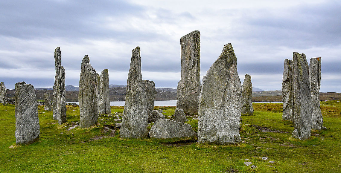 Callanais - Callanish Stones Just reminiscing pre-covid. A wild and windy day at this quite entrancing and spiritual location.<br />
<br />
Neolithic people erected the Callanish Stones about 5,000 years ago. Though the stones served as a hub for ritual activities for at least a millennium, their exact purpose has been lost to history. The most prevalent theory, based on recent archaeological excavations, holds that the megaliths acted as some sort of astronomical observatory or a celestial calendar.<br />
<br />
<a href="https://www.atlasobscura.com/places/callanish-stones" rel="nofollow">https://www.atlasobscura.com/places/callanish-stones</a> Fall,Geotagged,United Kingdom
