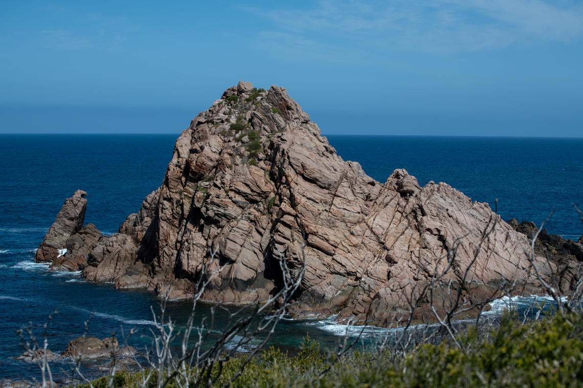 Sugar loaf rock This is a large natural granite rock that rises out of the Indian Ocean. It is separated by a thin channel of treacherous water that separates it from the mainland! It is one of the most photographed rocks in Australia and has appeared on the cover of National Geographic magazine. It is a nesting site for seabirds and the most southerly nesting site for the red-tailed tropic bird! Alas we didn’t see any today! Australia,Geotagged,Spring