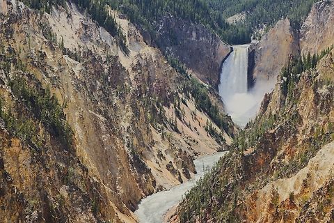 Yellowstone National Park Lower falls Lower Falls, are the biggest (308-foot) tall waterfall in Yellowstone. 

The canyon’s colors were created by hot water acting on volcanic rock. It was not these colors, but the river’s yellow banks at its distant confluence with the Missouri River, that occasioned the Minnetaree Indian name which French trappers translated as roche jaune, or yellow stone. The canyon has been rapidly eroded more than once, perhaps by great glacial outburst floods.
5N4A5021 Geotagged,Spring,United States;Lower falls,Yellowstone National Park