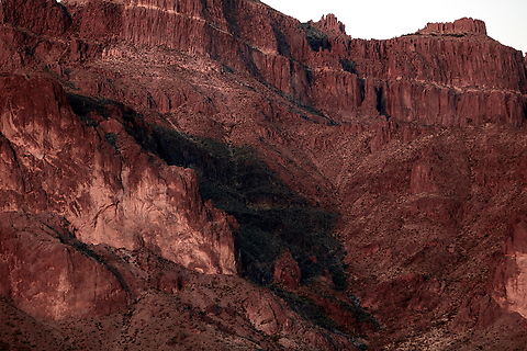 Pouncing Cougar shadow on Superstition Mountain during the equinox Superstition Mountain is a landmark on the east side of the Phoenix, Arizona valley. It is well known for an event that occurs twice a year during the equinox when the sun sets and the mountain creates a shadow in the image of a pouncing cougar. With a bit of imagination and eye squinting you can see the cougar. The image of the mountain shadow was taken about 1.5 miles west of the actual mountain looking east. I also like that you can zoom in on the image and see the saguaro cactus in the shadows. Geotagged,United States,Winter