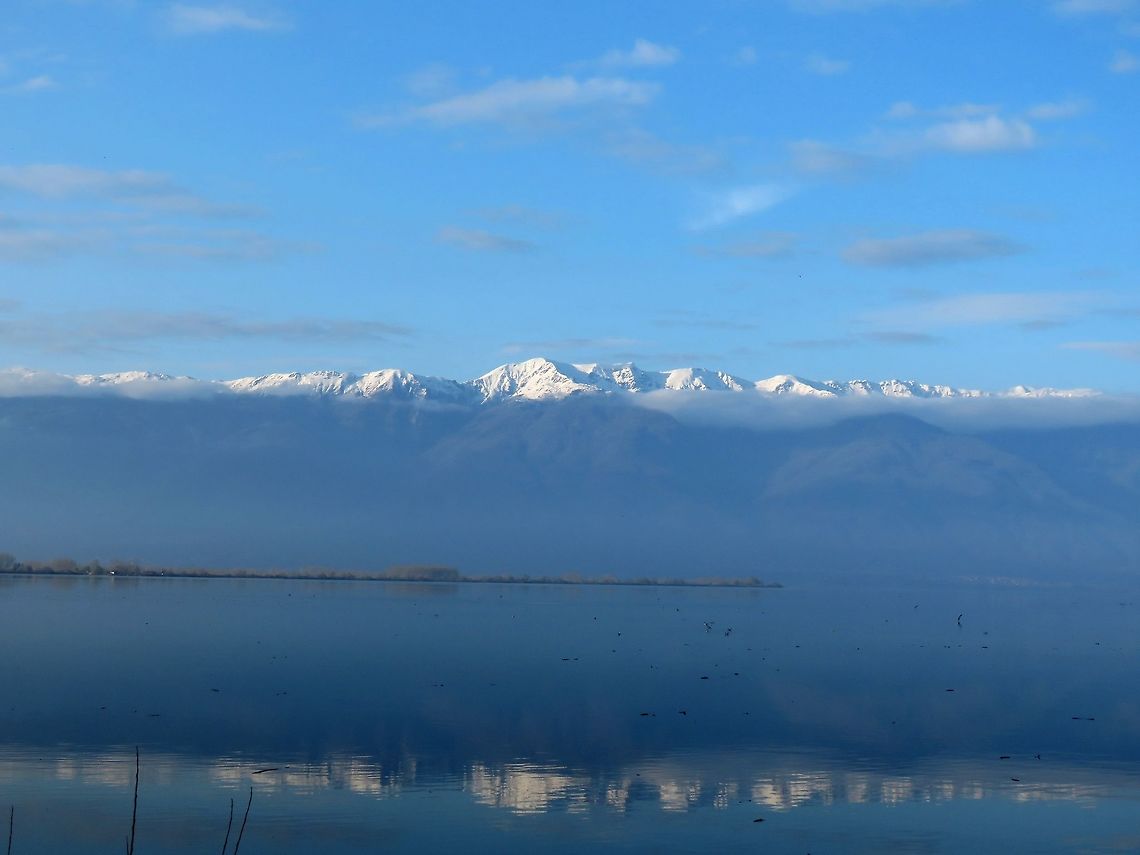 Mountain reflection in lake Kerkini When the sky cleared up in the late afternoon we were able to see this beautiful mountain. Geotagged,Greece,Mountain,Spring,lake Kerkini,reflection