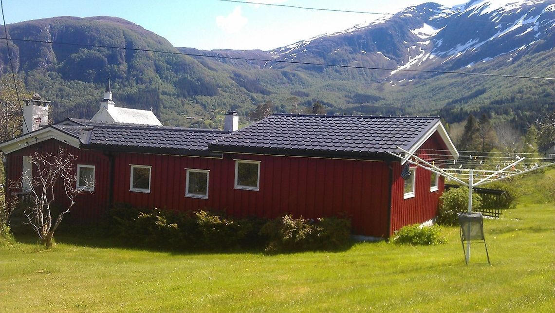 Spectacular landscape along the Norwegian coast This picture is taken in a small village called Davik, located at the northwestern coast of Norway, in Sogn og Fjordane county. Davik lays right next to the fjord Nordfjord. Here you can go fishing out on the fjord, or go hiking in the mountains. There is something for everyone to do. The red house is the summerhouse belonging to me and my parents. Mountains,Norway,landscape,nature