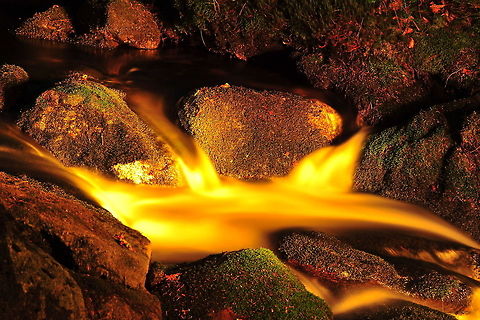 Evening shoot Germany Gold-coloured water streams across lava-like stones in Germany. Germany,Water