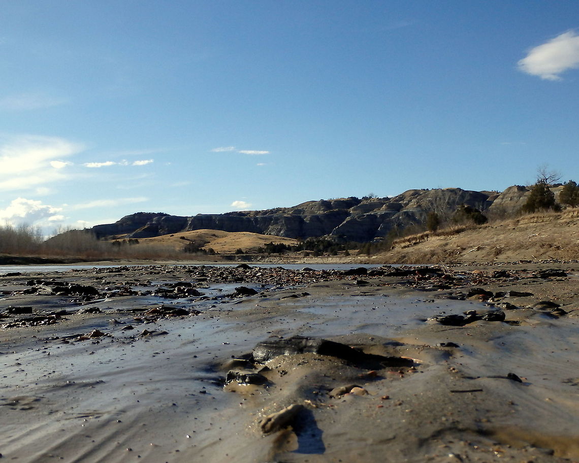 Little Missouri River Bed This photo shows the effects of water over the silt and smoothed stones in western North Dakota's Little Missouri River. Captured in the north unit of Theodore Roosevelt National Park. Geotagged,North Dakota,Theodore Roosevelt National Park,United States
