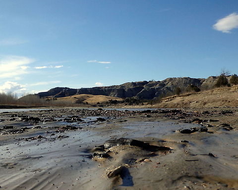 Little Missouri River Bed This photo shows the effects of water over the silt and smoothed stones in western North Dakota's Little Missouri River. Captured in the north unit of Theodore Roosevelt National Park. Geotagged,North Dakota,Theodore Roosevelt National Park,United States