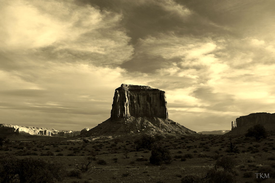 Merrick Butte - Monument Valley in B&W I am usually not one for a lot of post-processing with photos, but I do really like the look of this shot of Merrick Butte in black and white. I feel it gives it a much more powerful feel to the scene, especially with the dramatic clouds overhead. Captured in Monument Valley, northern Arizona. Arizona,Geotagged,Monument Valley Tribal Park,United States