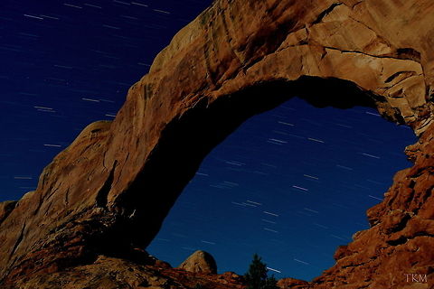 North Window Arch - Night Photography This is a photo of North Window Arch in Arches National Park taken in the very early morning ours. The shutter time on this photo is approximately 10 minutes. If you notice the dotted line to the upper left of the arch, that is actually a satellite orbiting earth. The light was provided by the moon, which actually turned out quite nice in my opinion! Arches National Park,Geotagged,Landscapes,Night,United States,Utah,fall