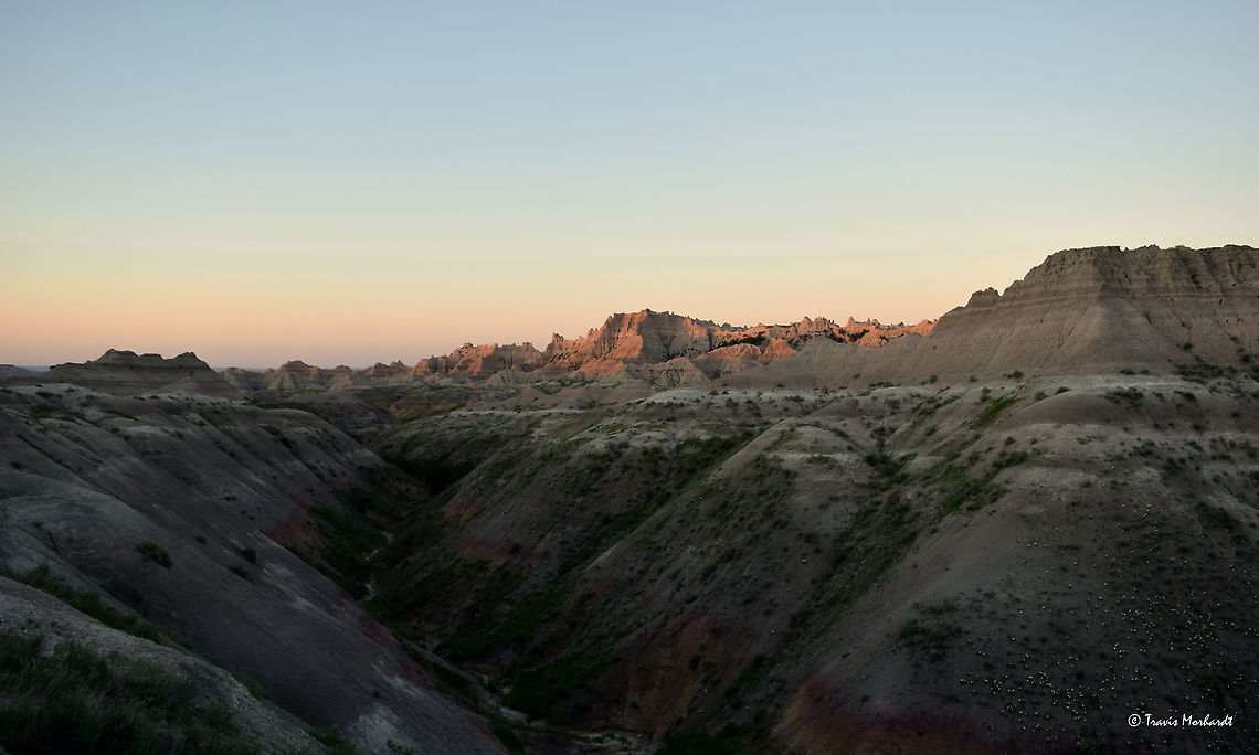 Badlands National Park Sunrise The rising sun illuminates the sand cliffs in South Dakota&#039;s Badlands National Park. This place is one of my favorites to watch the sun set and rise both for the beauty and for the lack of people. Badlands National Park,Geotagged,South Dakota,Summer,Sunrise,United States