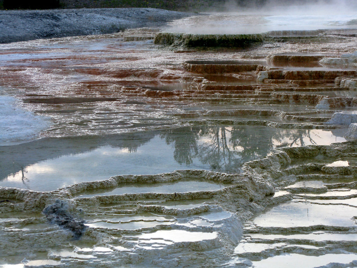 Mammoth Hot Springs 6 A terraced view of the Mammoth Hot Springs, showing red rock formation covered in a white chalk substance. Landscapes,Wyoming,Yellowstone National Park