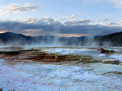 Mammoth Hot Springs 7 Landscape view of the Mammoth Hot Springs, with threatening clouds and geyser steam arising. Landscapes,Wyoming,Yellowstone National Park