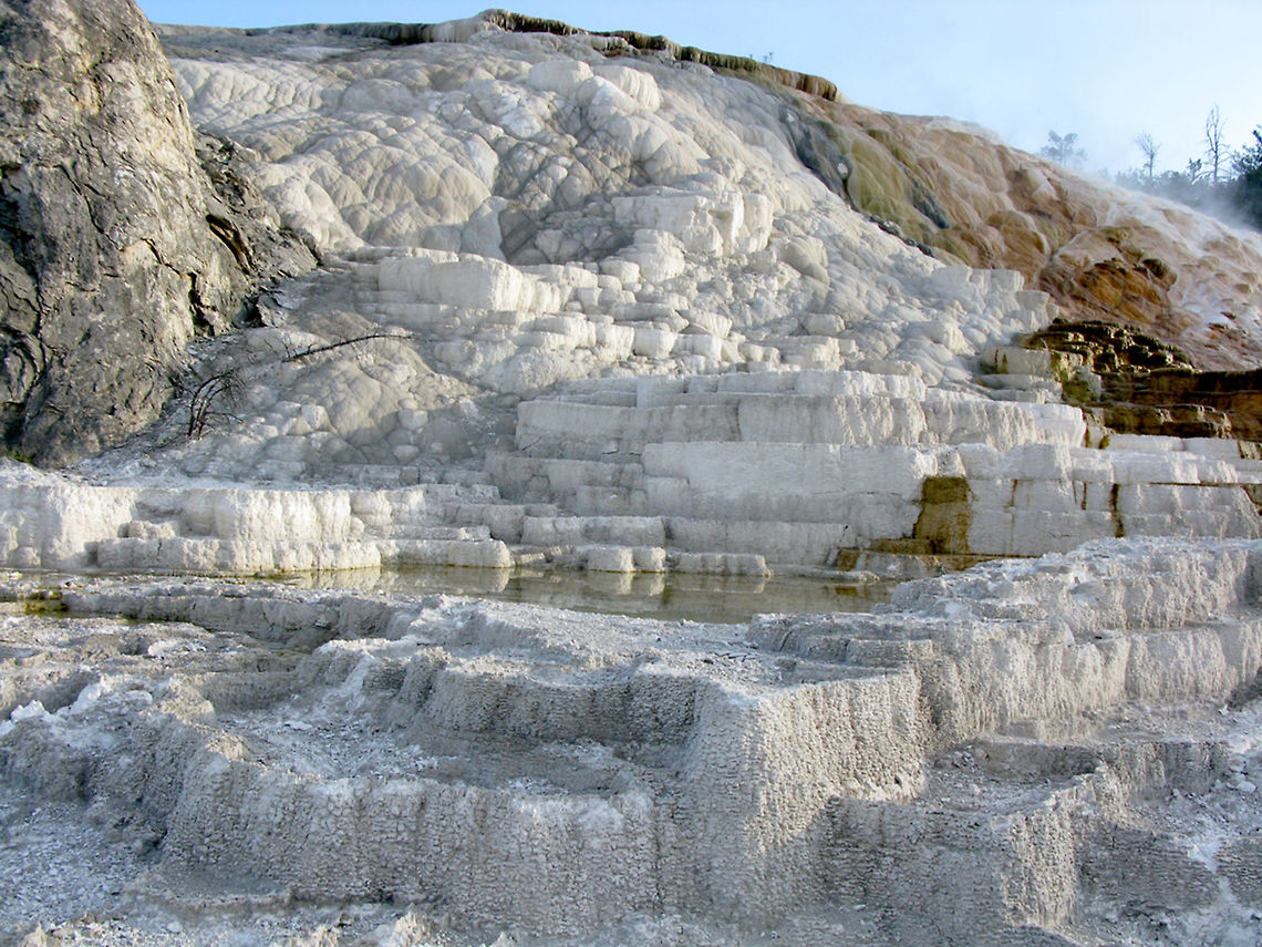 Minerva Terrace The Minerva Terrace is part of the Mammoth Hot Springs of Yellowstone. The formation is made up of travertine, a type of calcium that dissolves from limestone over the years.  Landscapes,Wyoming,Yellowstone National Park