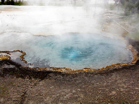 Yellowstone Small Geyser 3 A small bue geyser steams at Yellowstone. Geyser,Landscapes,Wyoming,Yellowstone National Park