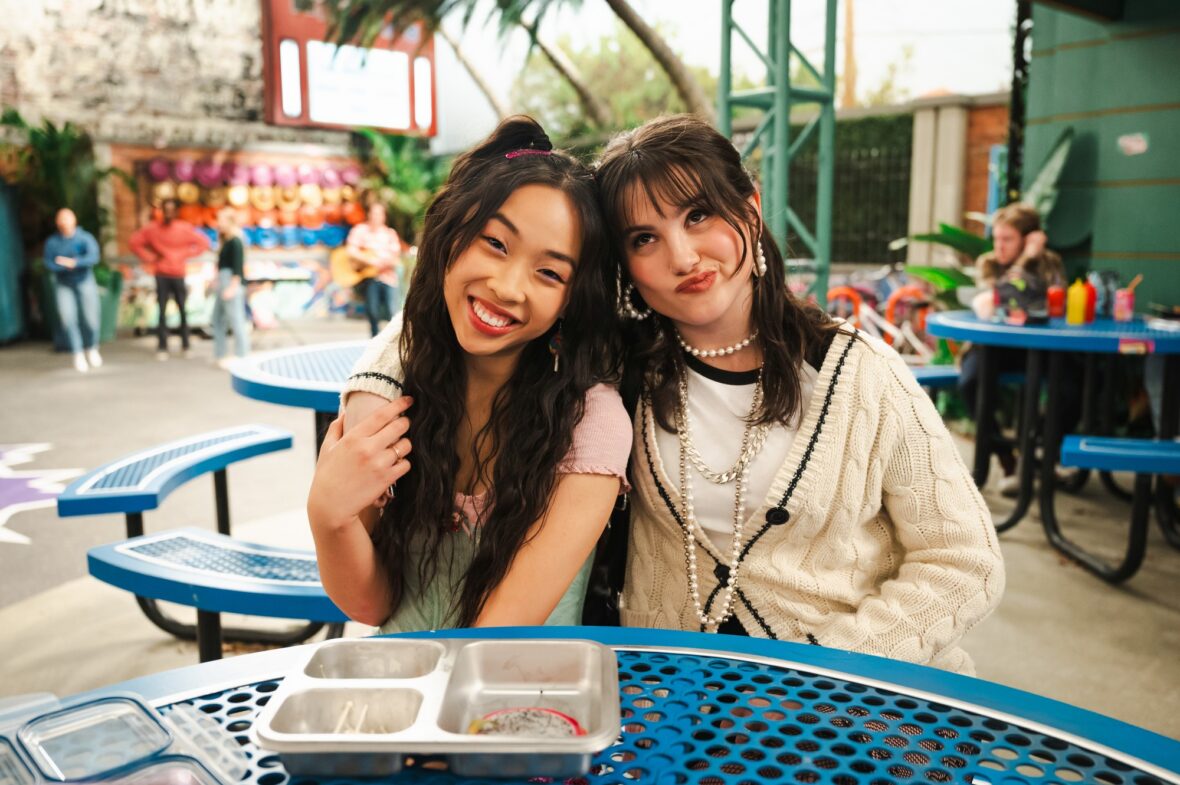 Emmy Liu-Wang and Erika Swayze pose for a photo on set of Hollywood Arts