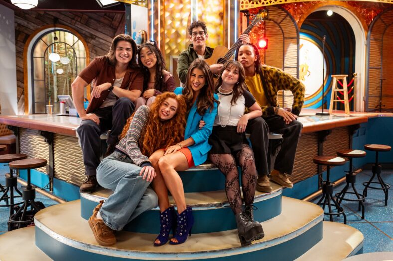 Martin Kamm, Emmy Liu-Wang, Alyssa Miles, Daniella Monet, Matt Bennett, Erika Swayze, Peyton Jackson pose for a group photo on set of Hollywood Arts