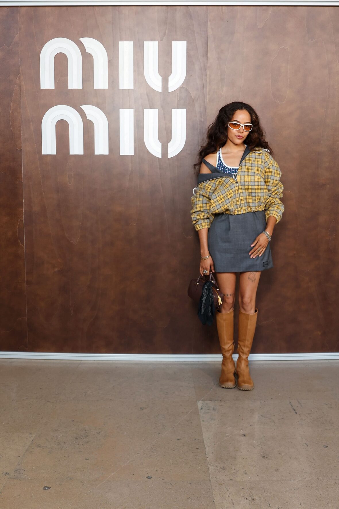 Quintessa Swindell attends the Miu Miu fashion show in Paris