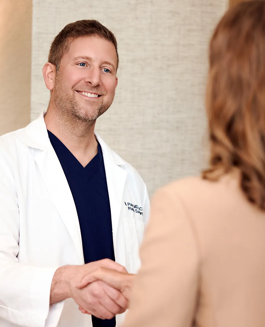 Dr. Plant meeting patient at Lawrence Park Plastic Surgery