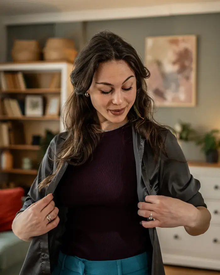 Woman trying on a shirt