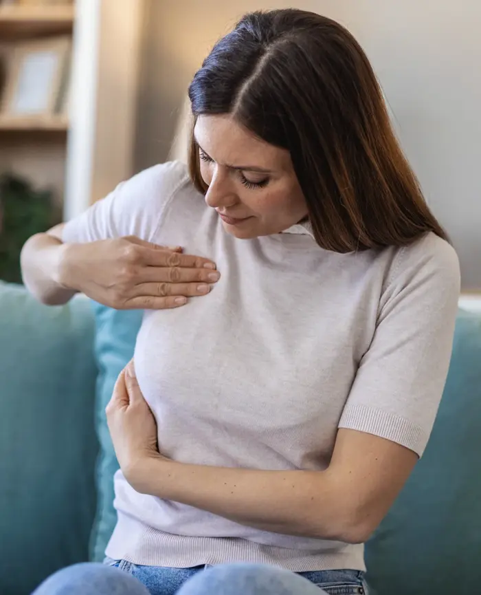 Woman checking her breast