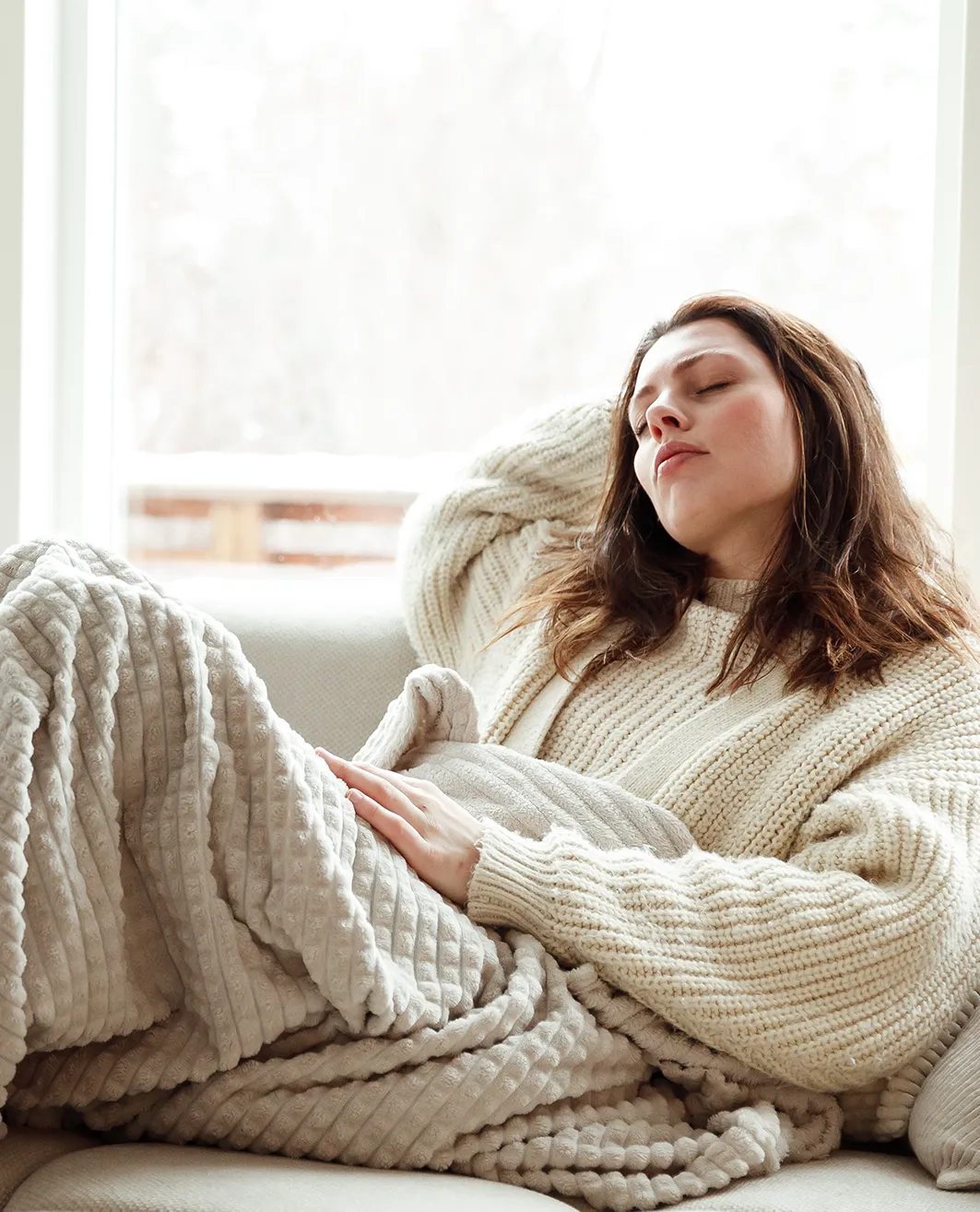 Woman resting on a couch
