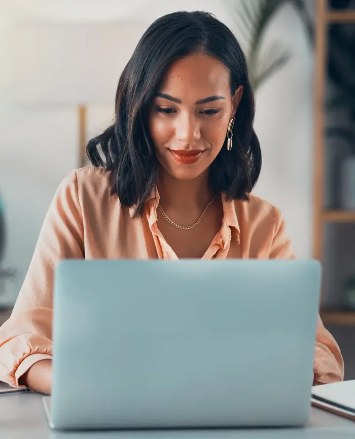 Woman researching on her laptop