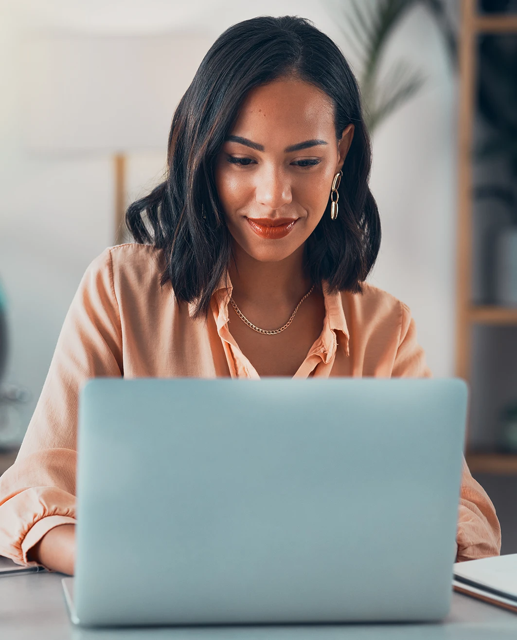 Woman researching on her laptop