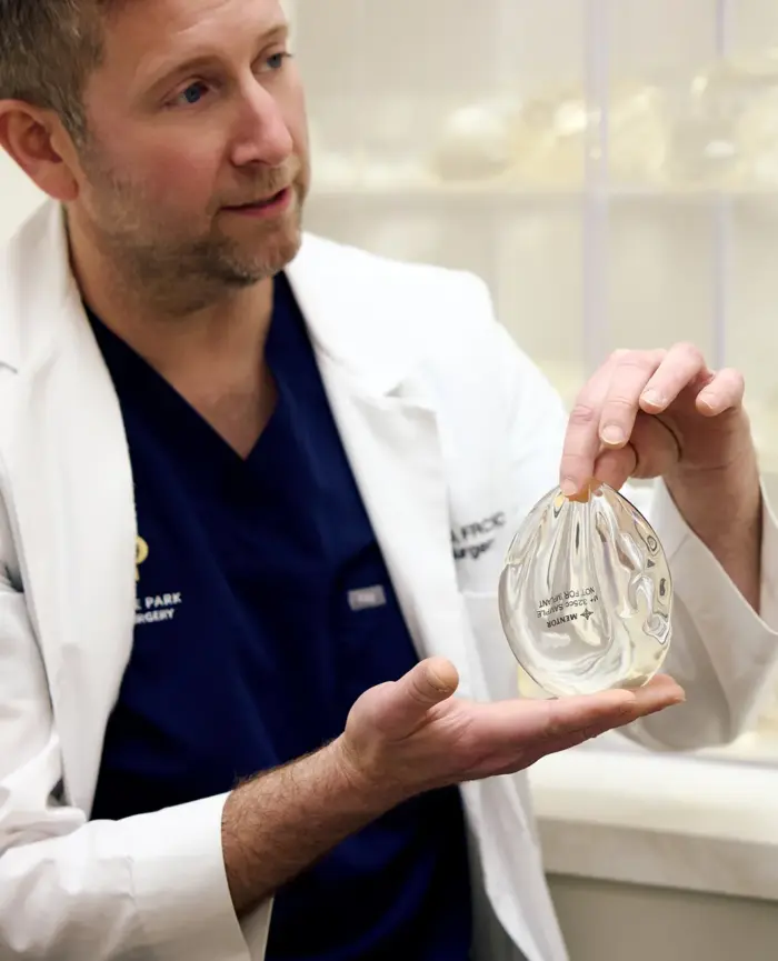 Surgeon explaining implants to a patient