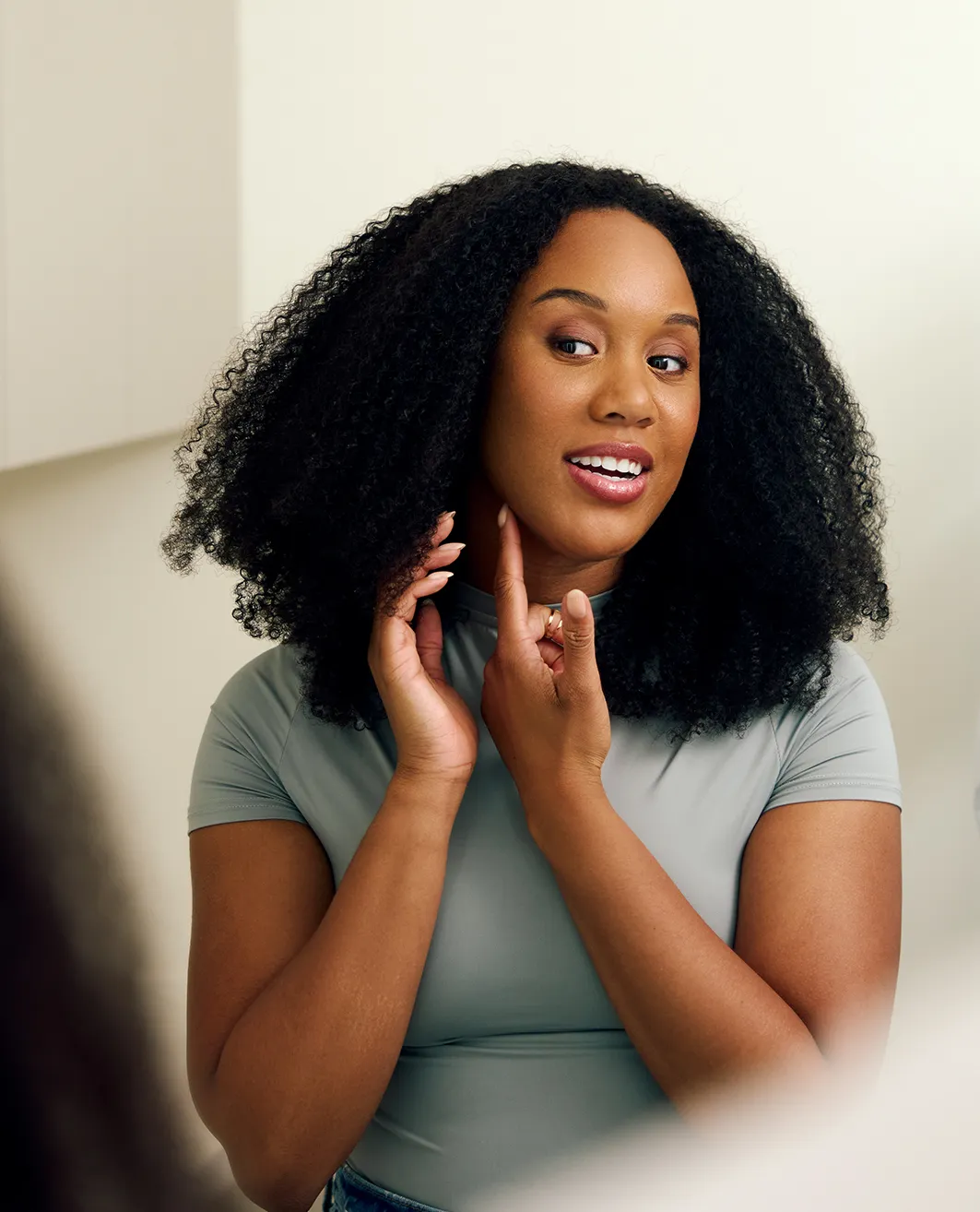 Woman speaking to surgeon while looking in the mirror