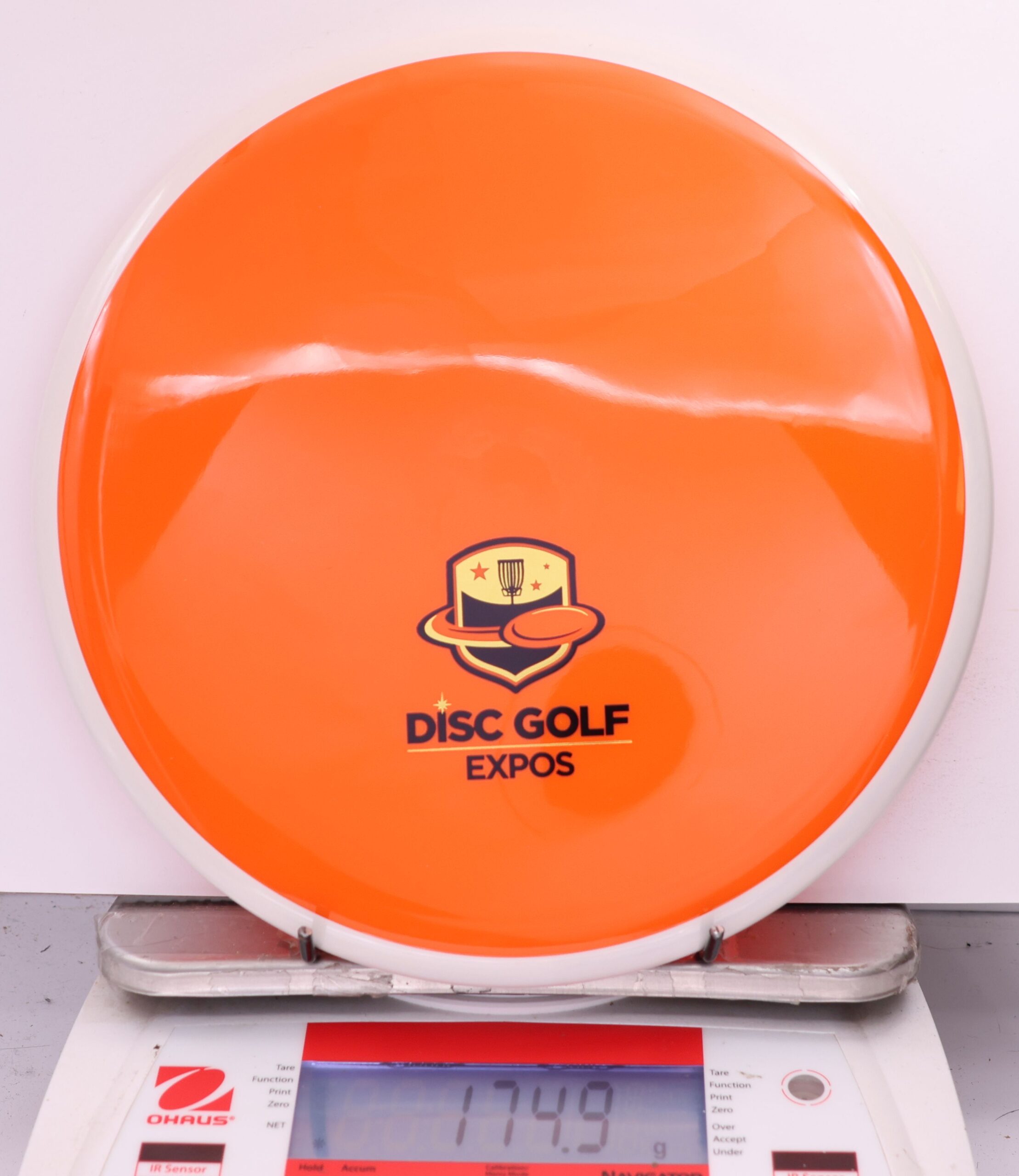 584264 Neutron Hex, 2026 Disc Golf Expos - #27 White-Orange, 175