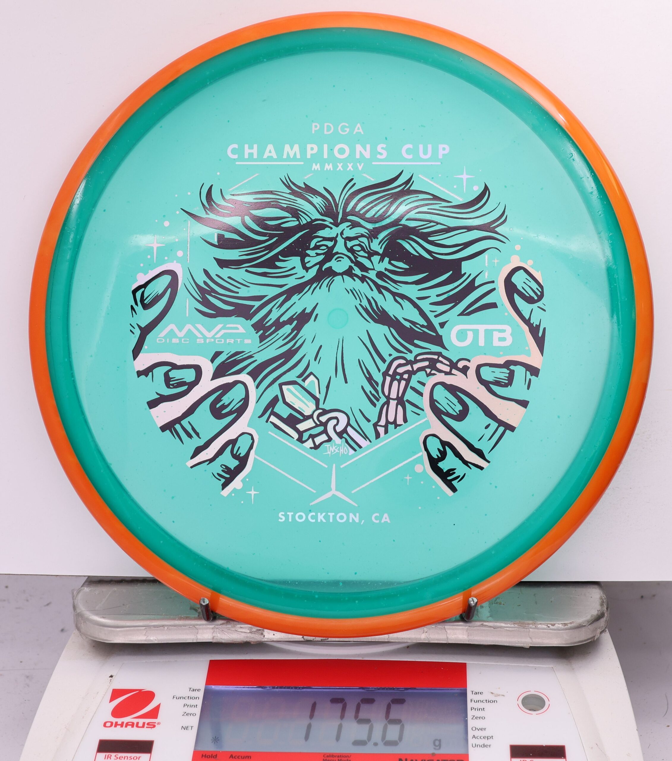 588935 Particle Glow Proton Hex, PDGA Champions Cup 2025 - #04 Orange-Teal, 176