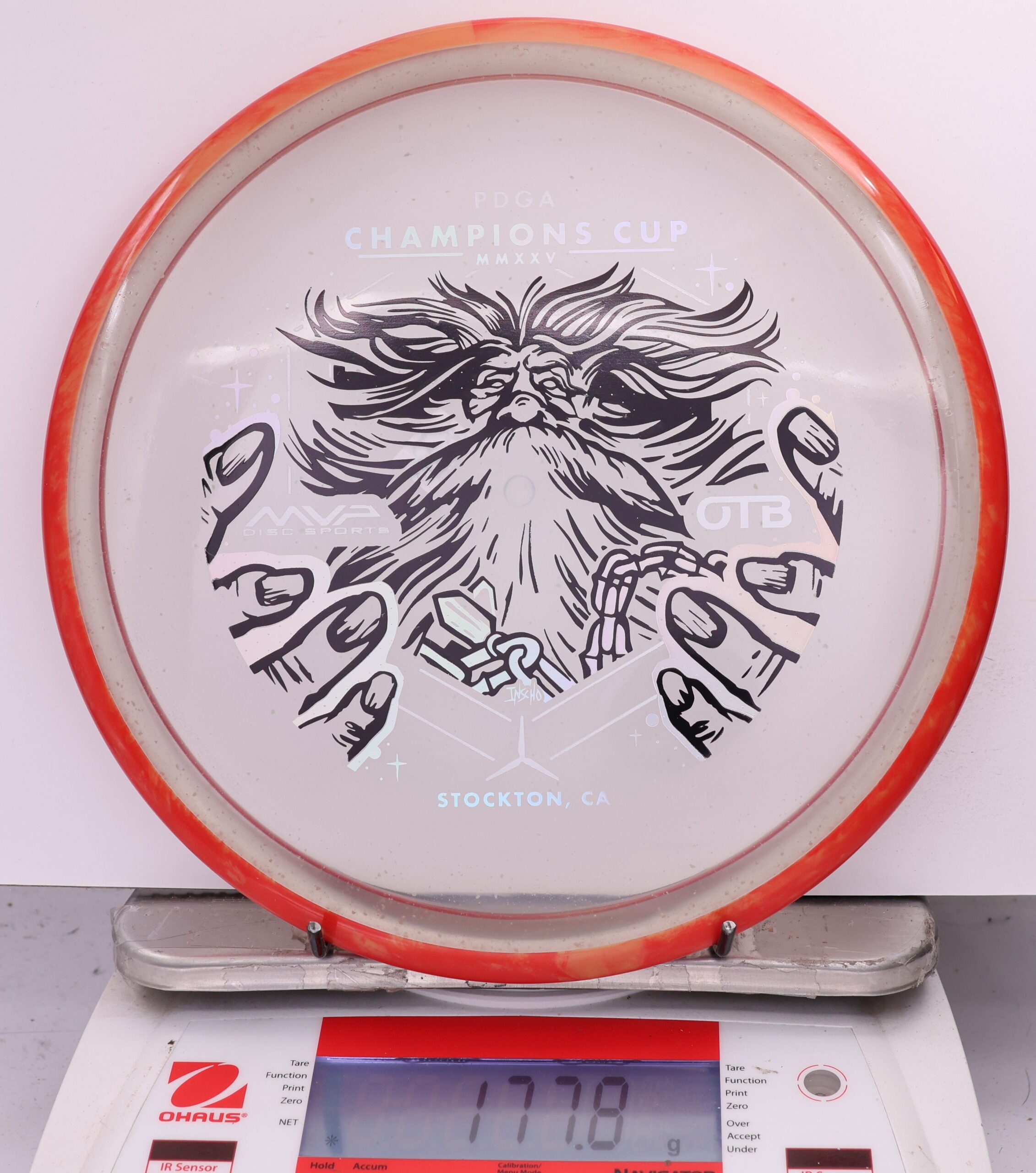 588964 Particle Glow Proton Hex, PDGA Champions Cup 2025 - #13 OrngRed-Clear, 178