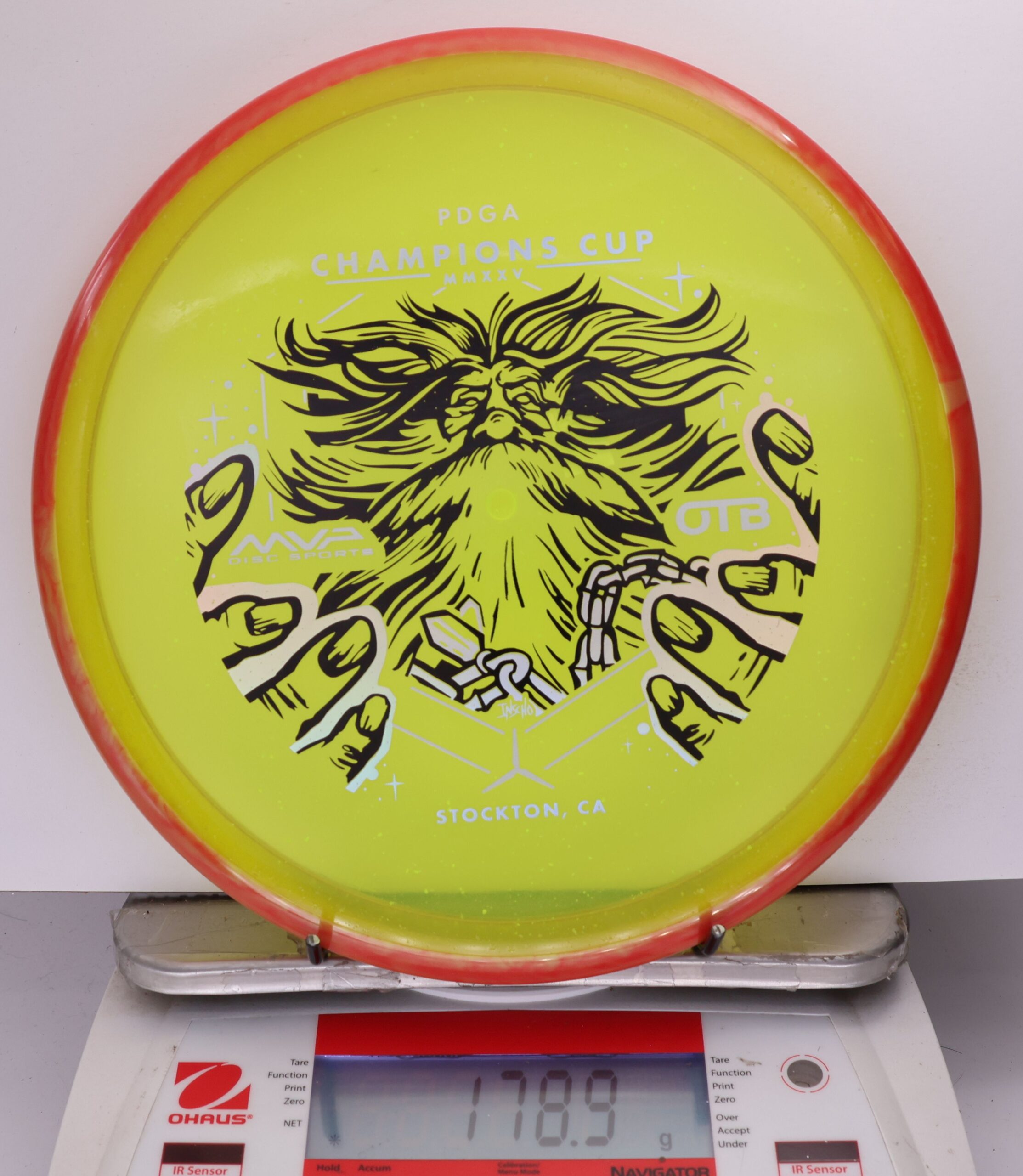 699594 Particle Glow Proton Hex, PDGA Champions Cup 2025 - #360 Red-Yellow, 179