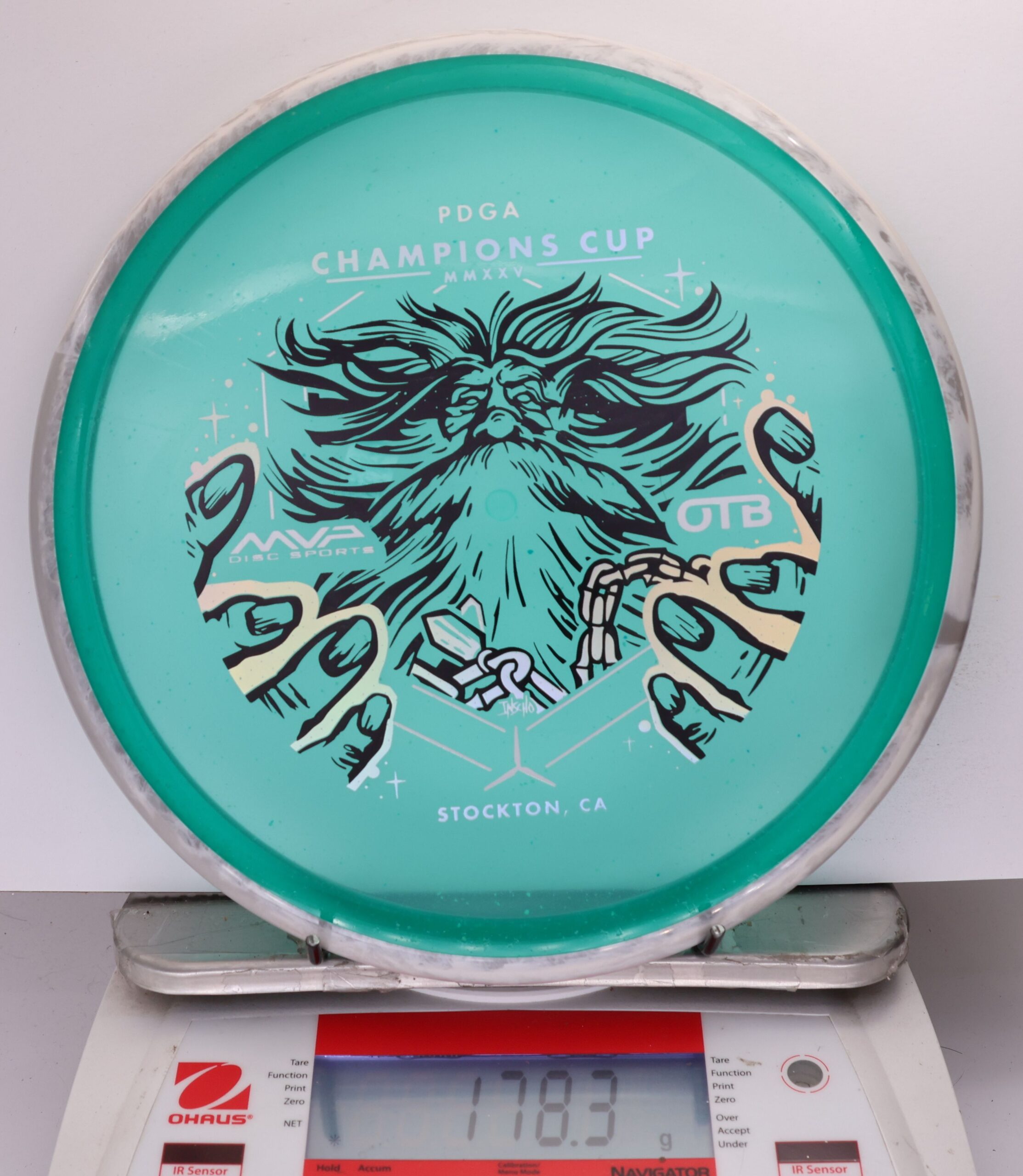 699609 Particle Glow Proton Hex, PDGA Champions Cup 2025 - #365 Gray-Teal, 178