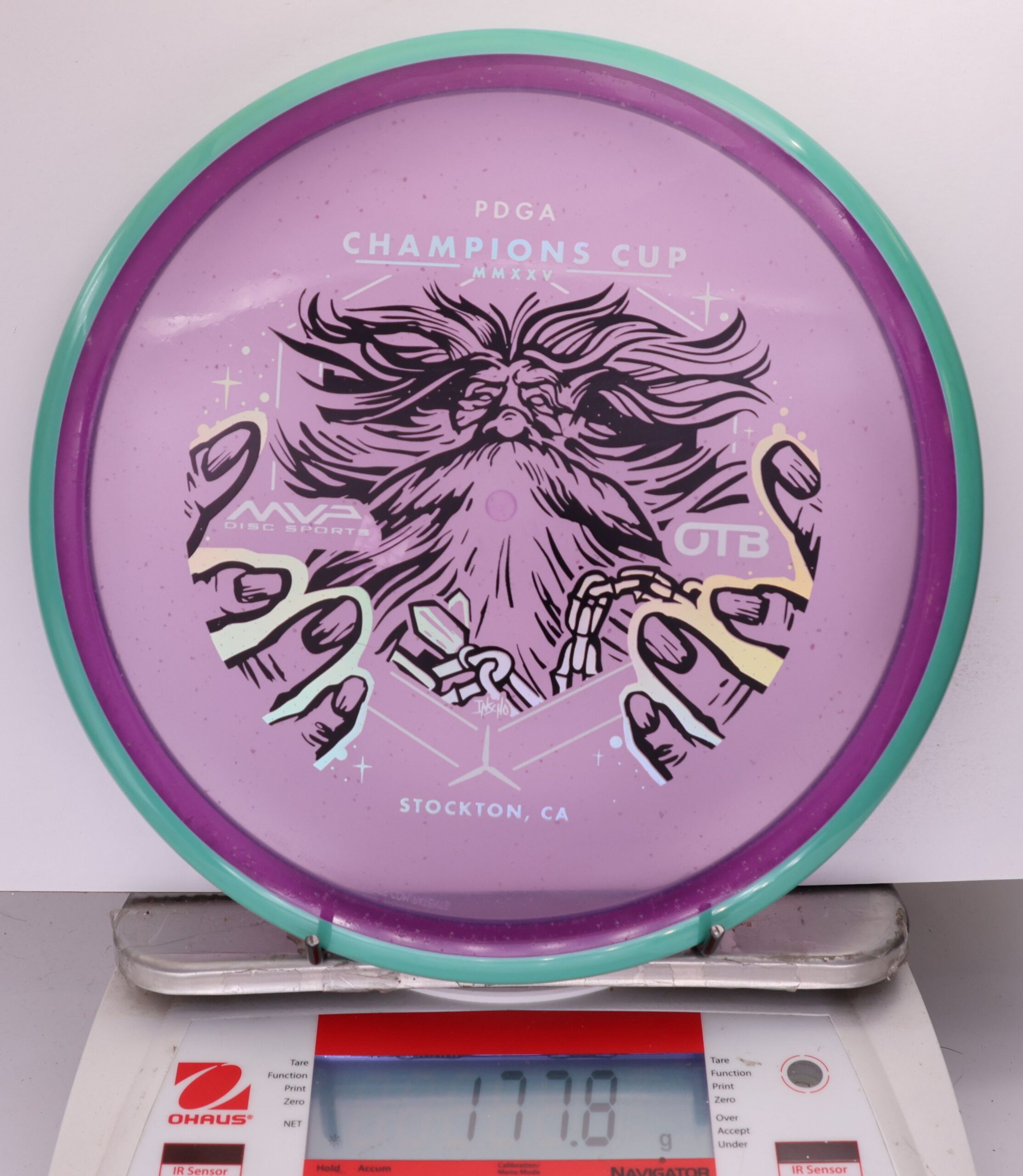 699613 Particle Glow Proton Hex, PDGA Champions Cup 2025 - #369 LtBlue-Purple, 178