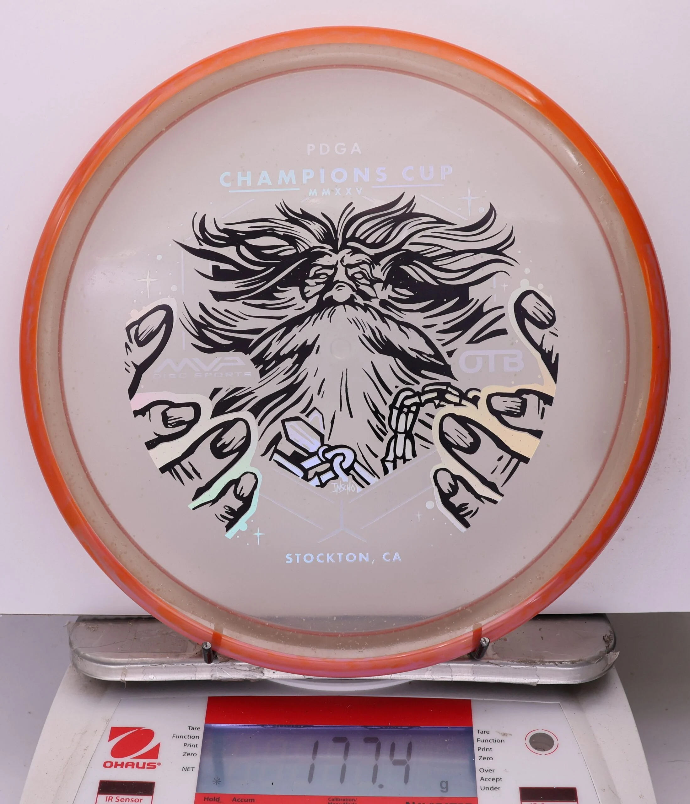 1039088 Particle Glow Proton Hex, PDGA Champions Cup 2025 - #389 RedOrange-Clear, 177