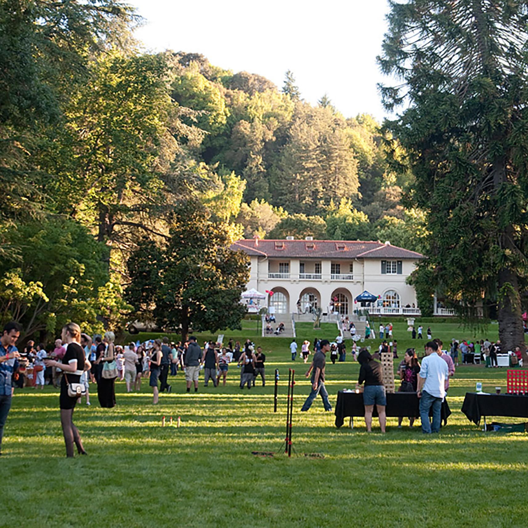 Image: A diverse crowd of people gathers on the Great Lawn at Montalvo. Photo: Bahara Emami
