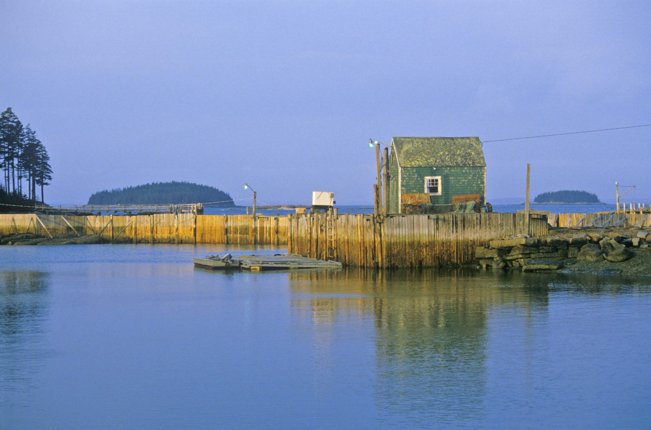 Penobscot-shorline-quaint Lobster house on edge of Penobscot Bay in autumn