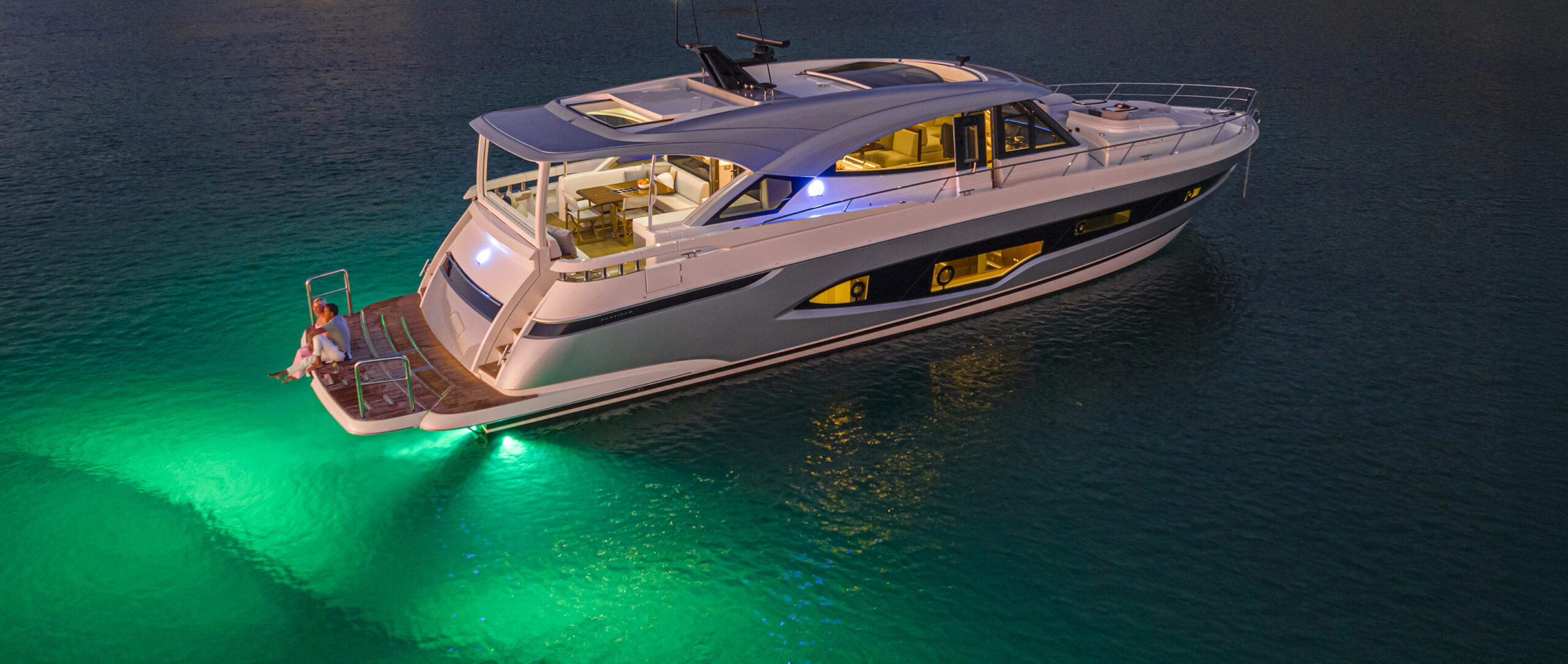 top2_Riviera 6800 Sport Yacht PE Anchored 021 Riviera 6800 Sport Yacht with underwater lights on at anchor