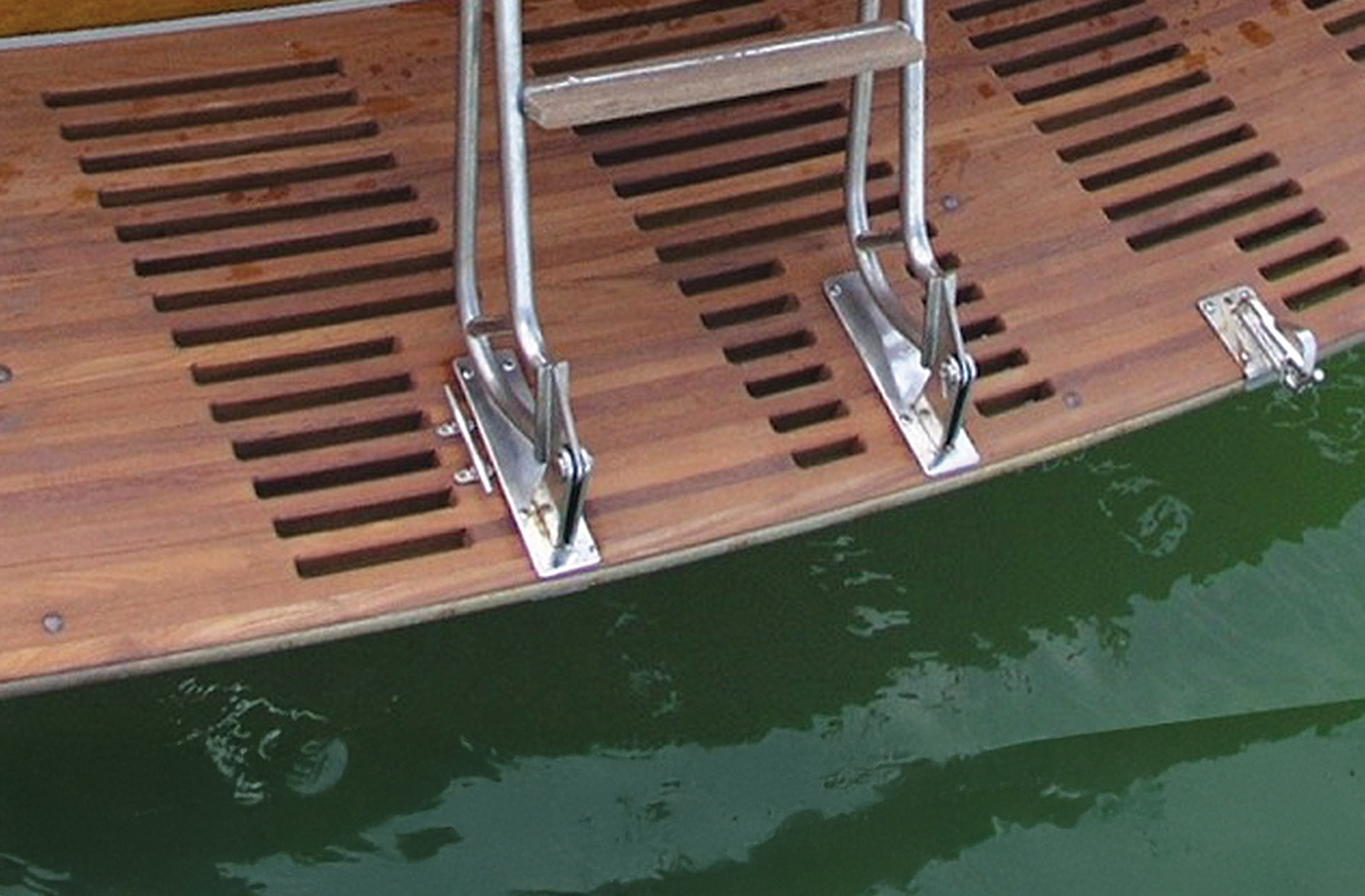 Teak swim platform with ladder.