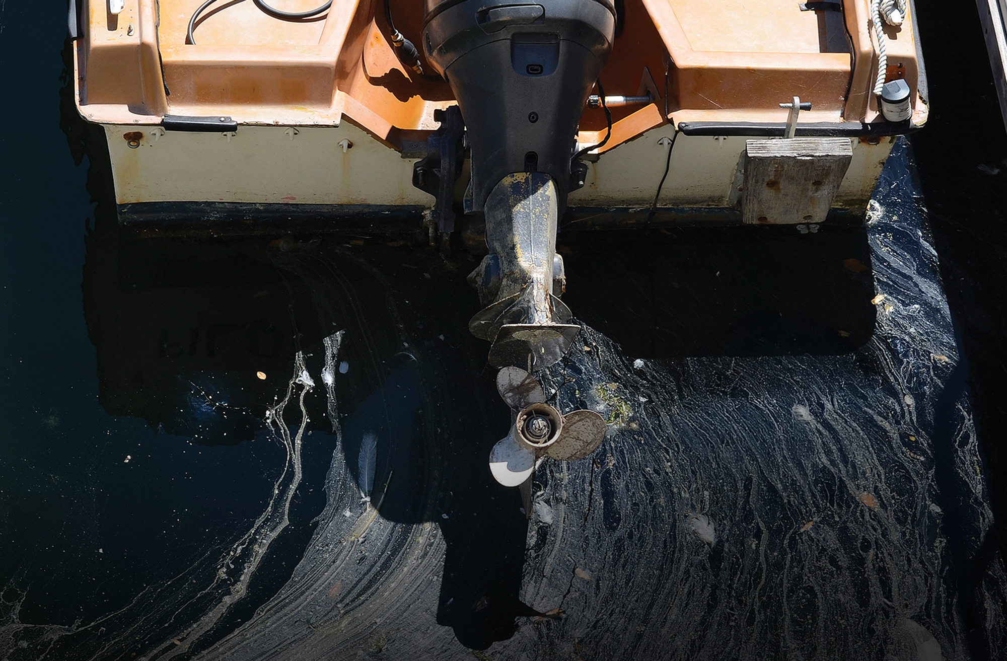 Fuel spill coming off transom of a boat