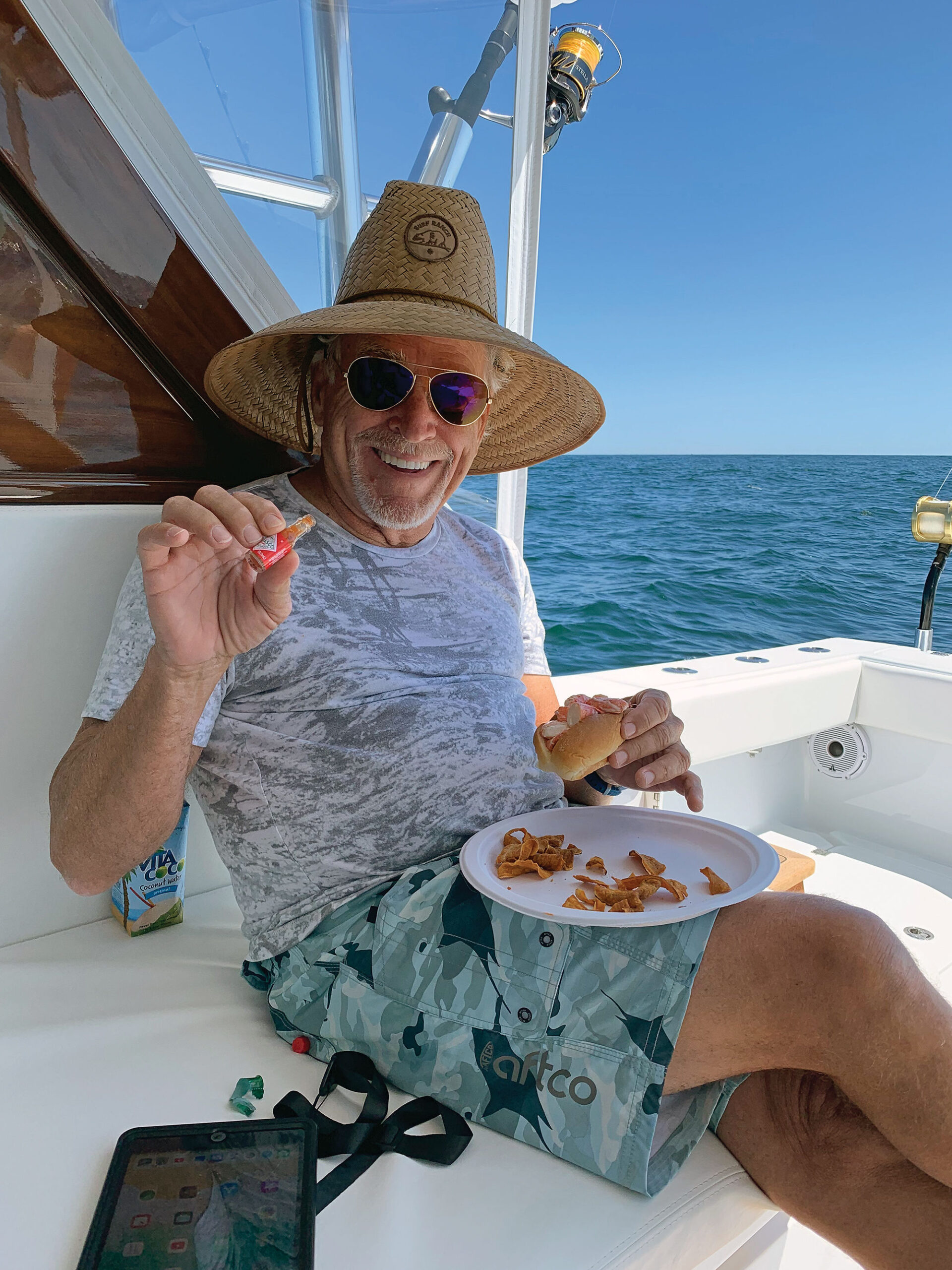 Keeping things spicy, Jimmy enjoys a lobster roll while fishing in New England waters.
Photo property of Last Mango Boatworks