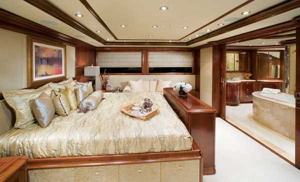 A full-beam master on a yacht in the 120-foot size range is common. But this on-deck one features pocket doors leading to a luxurious marble bath.