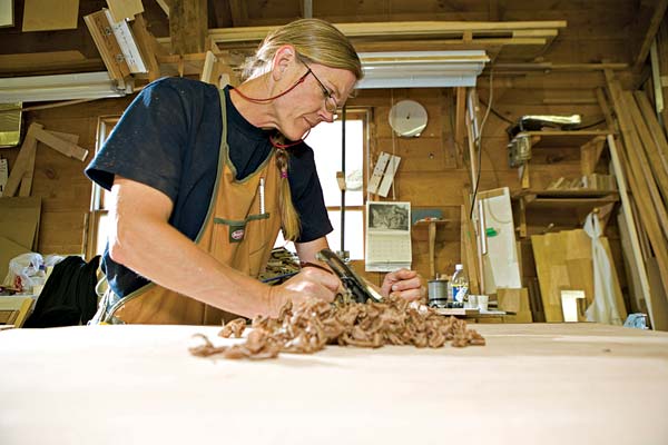 respect-g1.jpg promo image Kristen Terpening hand planes a red birch table's walnut trim, but there's a big, new, top-of-the-line Italian power planer for other tasks.