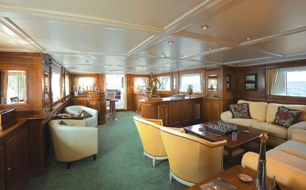 globe-engineering-savvy-g1.jpg promo image Compact but comfortable: Savvy's saloon contains a games table and a bar (in the aft corner, to starboard upon entering from the aft deck).