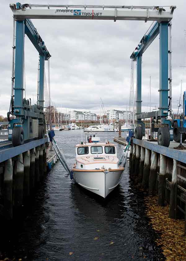 Geting a boat ready to travel by truck isn't that much different than hauling her for the winter. Here the Ava T. is lifted out on the TraveLift, gets a quick pressure cleaning, and then is lowered onto the trailer.