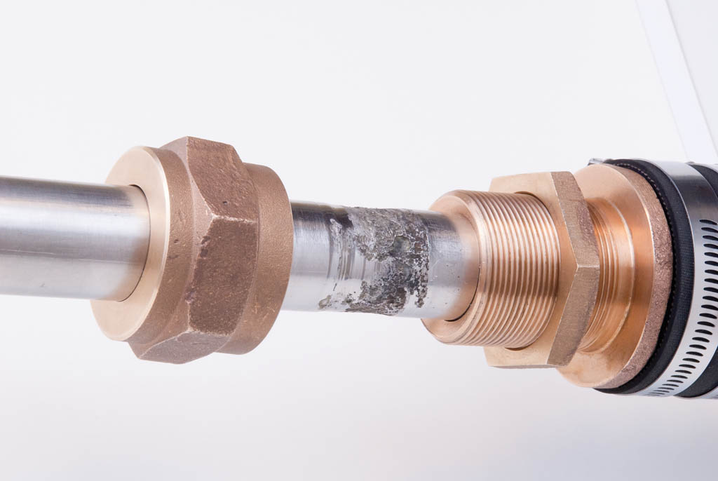 Two parts of a stuffing box squeeze rings of packing around the shaft to form a seal.