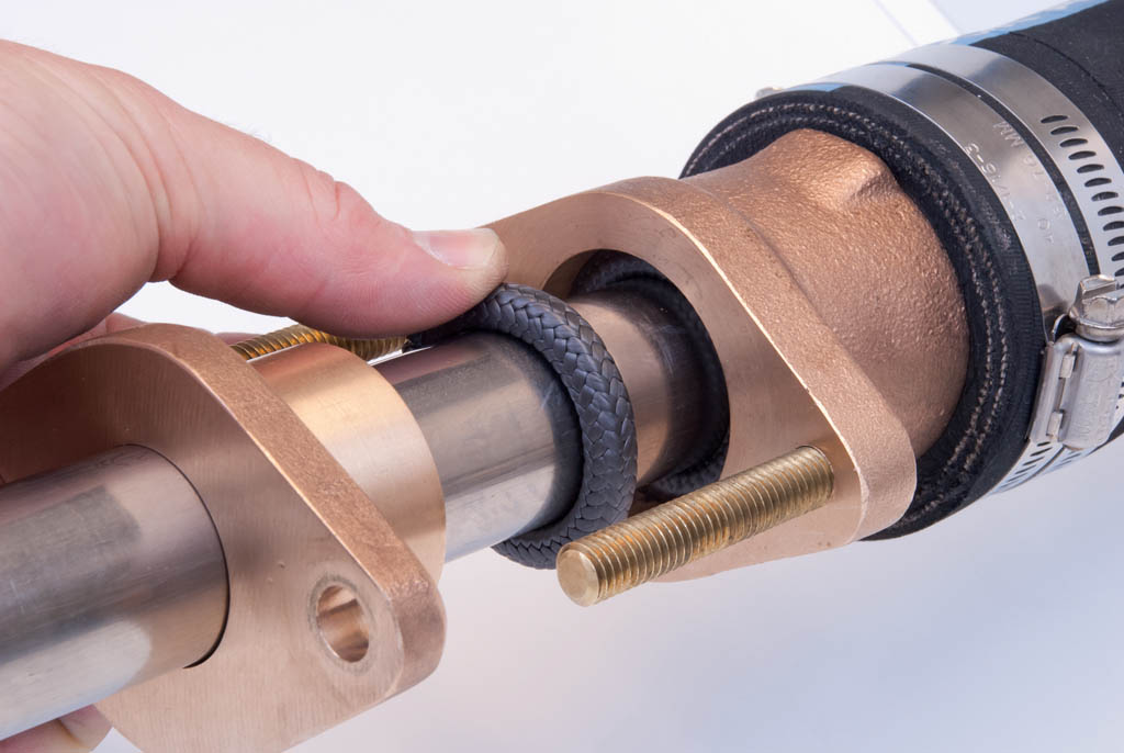 A spud-type stuffing box is threaded with one large nut that contains the packing.
